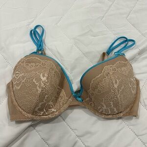 Padded nude bra with baby blue silk trim